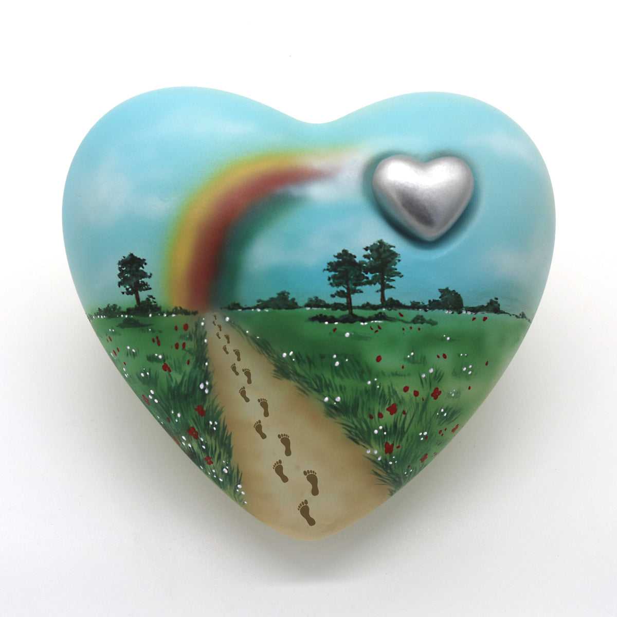 Humanurne in Herzform mit einer Regenbogenlandschaft