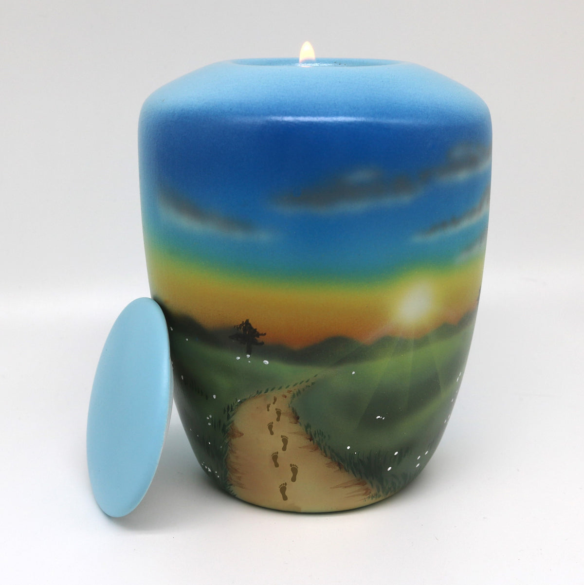 Tierurne mit Teelichteinsatz mit einer Sonnenuntergangslandschaft bemalt