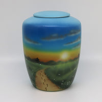 Tierurne mit Teelichteinsatz mit einer Sonnenuntergangslandschaft bemalt